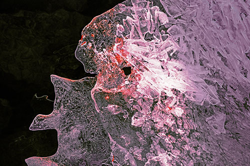 Two Faced Optical Illusion Ice Face Hanging Above River (Red Tint)