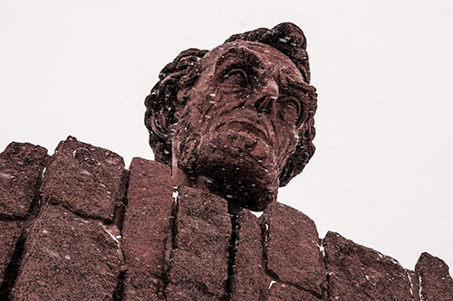Blowing Snow Across Presidential Statue Head (Red Tone Photo)