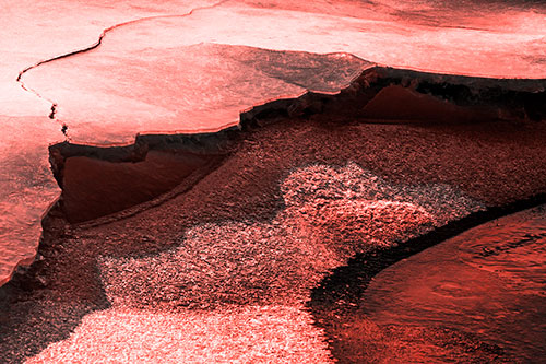 Cracked Ice Frozen Shoreline Melting (Red Tone Photo)