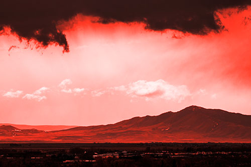 Dark Cloud Mass Above Mountain Range Horizon (Red Tone Photo)