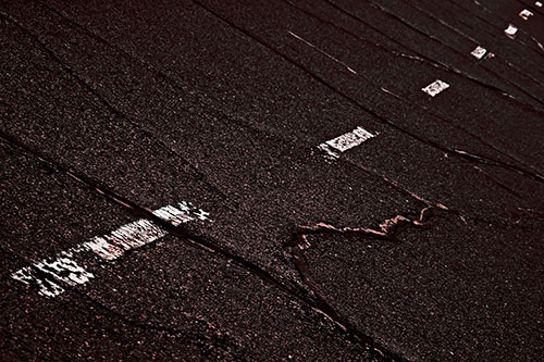 Decomposing Pavement Markings Along Sidewalk (Red Tone Photo)