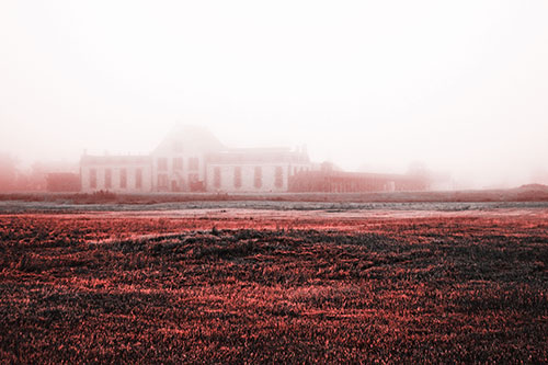 Dense Fog Consumes Distant Historic State Penitentiary (Red Tone Photo)