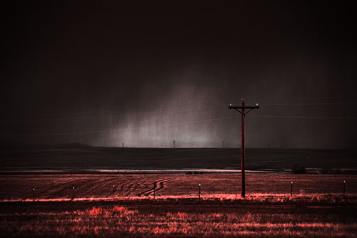 Distant Thunderstorm Rains Down Upon Powerlines (Red Tone Photo)