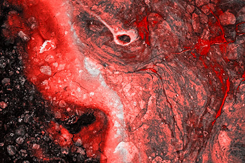 Distressed Oil Face Swirling Among Rocky Shore (Red Tone)