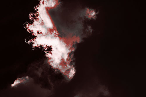 Evil Cloud Face Snarls Among Sky (Red Tone Photo)