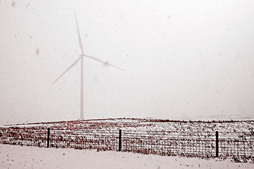 Fenced Wind Turbine Among Blowing Snow (Red Tone)