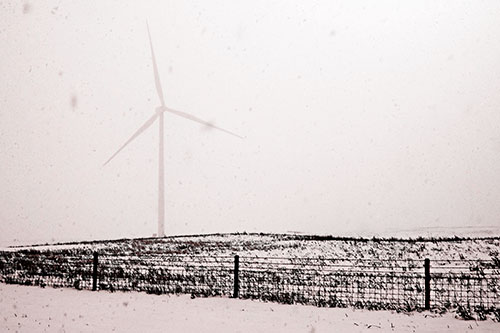 Fenced Wind Turbine Among Blowing Snow (Red Tone Photo)