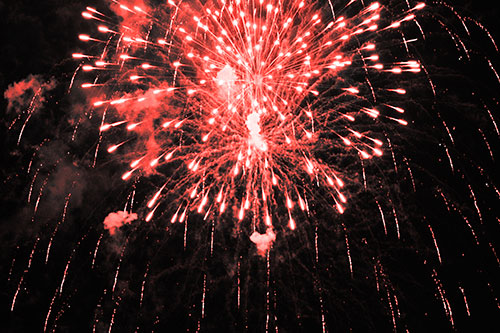 Fireworks Explosion Lights Night Sky Ablaze (Red Tone Photo)