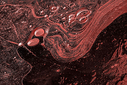 Frozen Bubble Clusters Among Twirling River Ice (Red Tone)