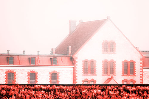 Historic State Penitentiary Oozes Among Fog (Red Tone Photo)