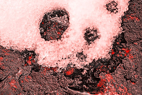Ice Skull Snow Face Melting Atop Rock (Red Tone)