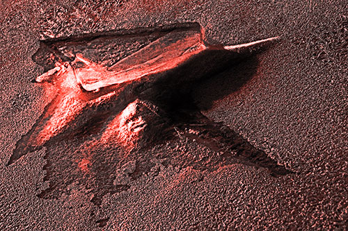 Jagged Melting River Ice Submerging (Red Tone Photo)
