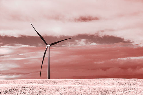 Lone Wind Turbine Standing Along Dry Prairie Horizon (Red Tone Photo)