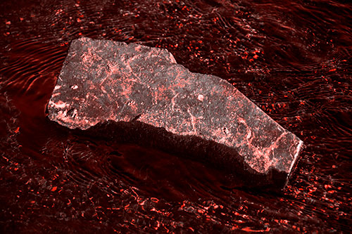 Massive Rock Atop Riverbed (Red Tone Photo)