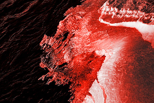 Melting Ice Face Creature Atop River Water (Red Tone)