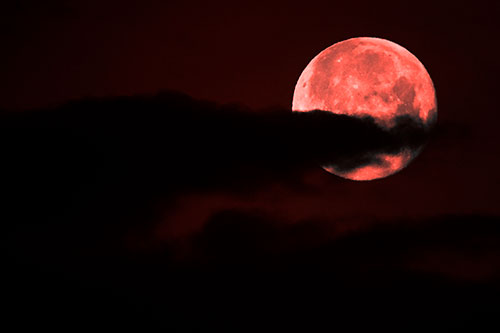 Pac Man Moon Swallows Clouds (Red Tone Photo)