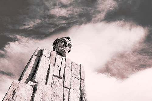 Presidents Statue Standing Tall Among Clouds (Red Tone Photo)