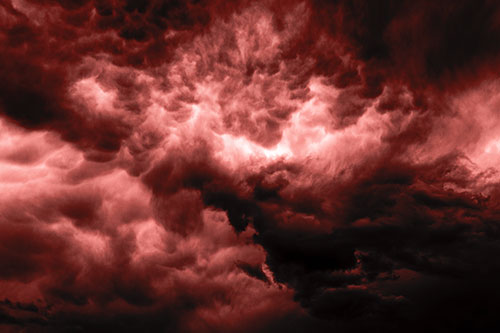Raging Thunderstorm Clouds Brewing Among Sky (Red Tone)