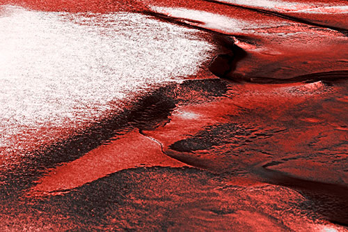 Sloping Ice Melting Atop River Water (Red Tone Photo)