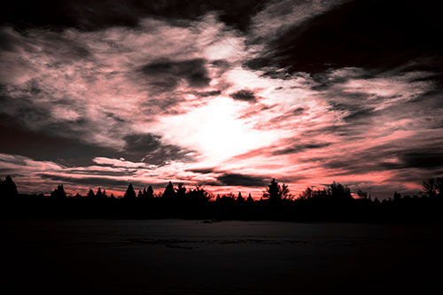 Sun Vortex Illuminates Clouds Above Dark Lit Lake (Red Tone Photo)