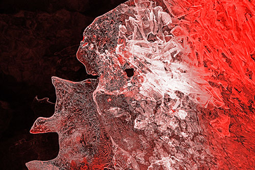 Two Faced Optical Illusion Ice Face Hanging Above River (Red Tone Photo)