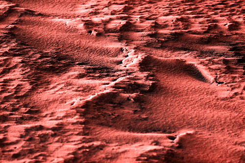 Wind Blowing Across Jagged Frozen Snow Drift (Red Tone Photo)