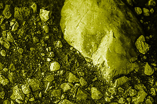 Alien Skull Rock Face Emerging Atop Dirt Surface (Yellow Shade Photo)