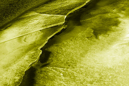 Cracking Blood Frozen Ice River (Yellow Shade Photo)