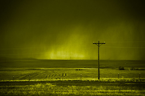 Distant Thunderstorm Rains Down Upon Powerlines (Yellow Shade Photo)