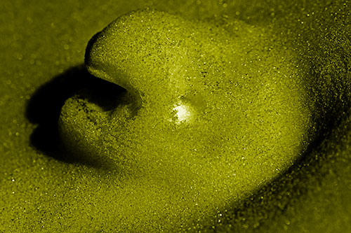Glowing Eyed Snow Face Emerges Above Soil (Yellow Shade)
