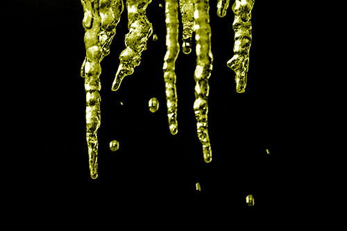 Jagged Melting Icicles Dripping Water (Yellow Shade Photo)