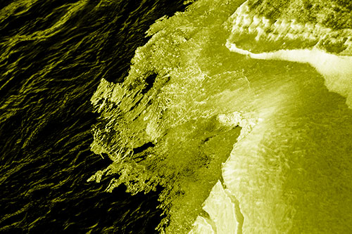 Melting Ice Face Creature Atop River Water (Yellow Shade Photo)