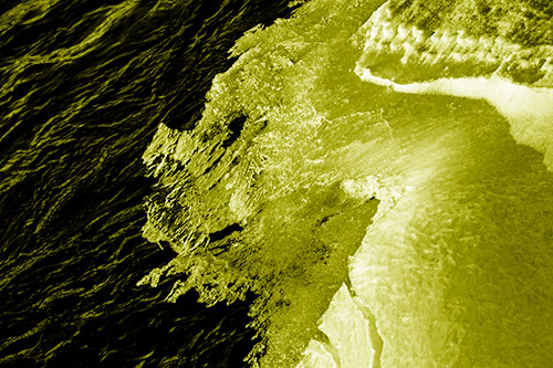 Melting Ice Face Creature Atop River Water (Yellow Shade)