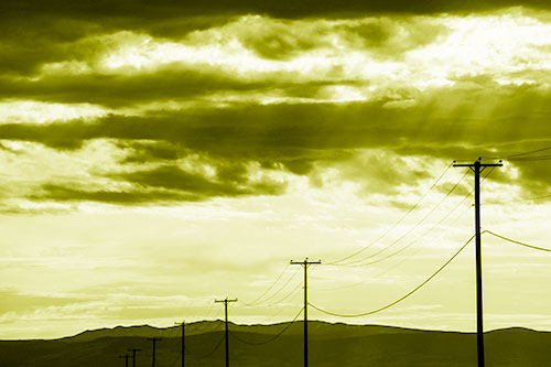 Powerline Silhouette Entering Mountain Range (Yellow Shade Photo)