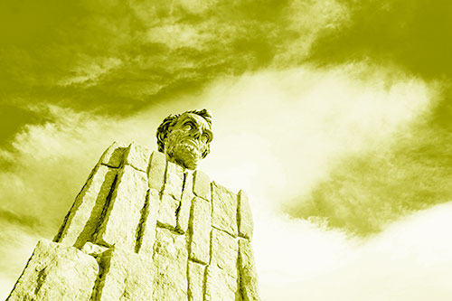 Presidents Statue Standing Tall Among Clouds (Yellow Shade Photo)