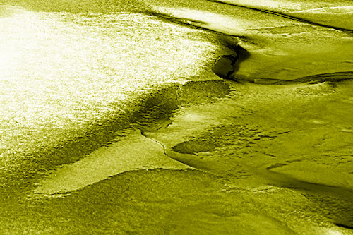 Sloping Ice Melting Atop River Water (Yellow Shade Photo)