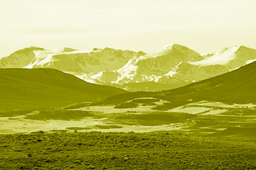 Snow Capped Mountains Behind Hills (Yellow Shade Photo)