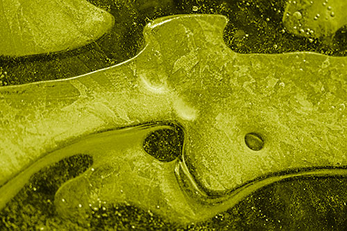 Swirling Frozen Smiling Bubble Eyed River Ice Face (Yellow Shade Photo)