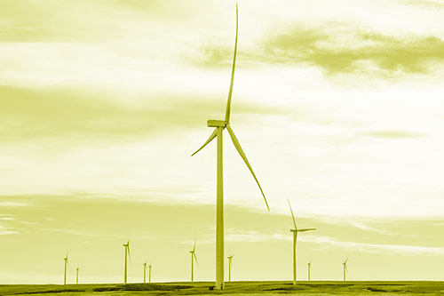 Wind Turbine Standing Tall Among The Rest (Yellow Shade Photo)