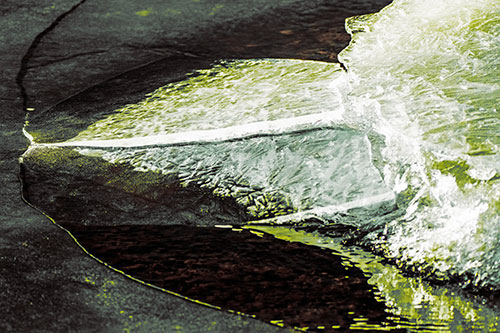 Abstract Ice Sculpture Forms Atop Frozen River (Yellow Tint Photo)