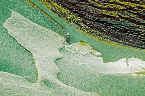 Broken Cracked Ice Along Shoreline (Yellow Tint)