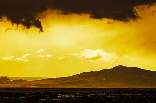 Dark Cloud Mass Above Mountain Range Horizon (Yellow Tint Photo)