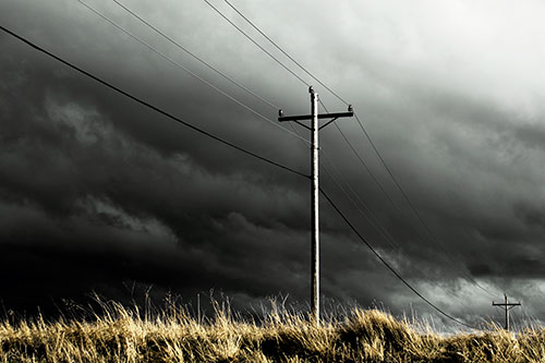 Dark Thunderstorm Clouds Over Powerline (Yellow Tint Photo)