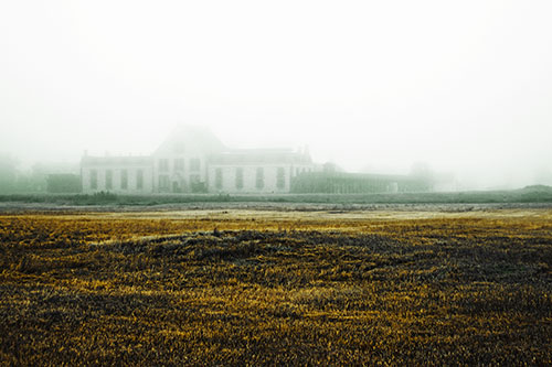 Dense Fog Consumes Distant Historic State Penitentiary (Yellow Tint Photo)