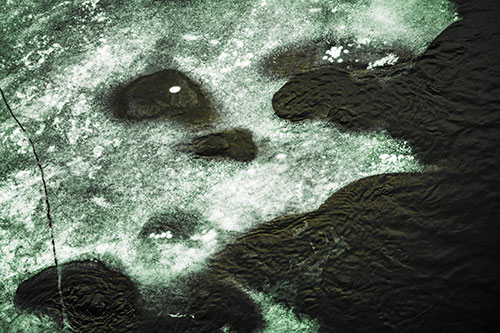 Disintegrating Ice Face Melting Among Flowing River Water (Yellow Tint)