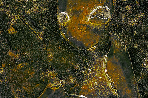 Mouthless Alien Ice Figure Forms Among Frozen River Water (Yellow Tint)