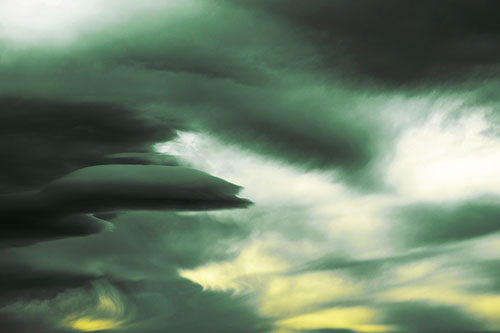 Smooth Cloud Sails Along Swirling Formations (Yellow Tint Photo)