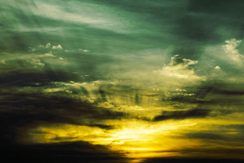 Sunrise Bursting Colorful Light Past Clouds (Yellow Tint Photo)