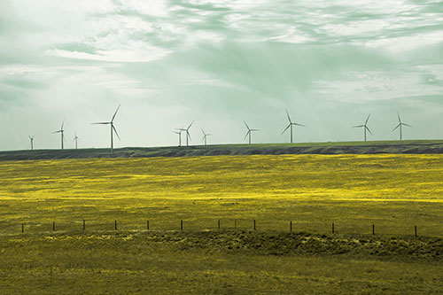 Wind Turbines Scattered Along The Prairie Horizon (Yellow Tint Photo)
