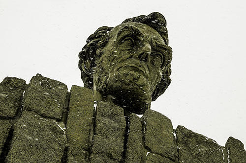 Blowing Snow Across Presidential Statue Head (Yellow Tone Photo)